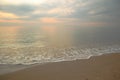 Beautiful sand beach background with soft wave in the morning. Royalty Free Stock Photo
