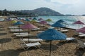 Beautiful Sand Beach Of Kusadasi With Colorful Straw Umbrellas And Lounge Chairs, Aegean Sea,Turkey.