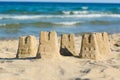 Beautiful sand castles on beach near sea Royalty Free Stock Photo