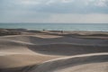 Beautiful sand dunes at al Khaluf beach. Offroad cars driving dunes Royalty Free Stock Photo