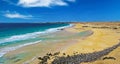 Beautiful sand dunes landscape, empty wild natural beach Playa del Aljibe, blue atlantic ocean lagoon,  steep cliff with white Royalty Free Stock Photo
