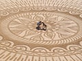 Beautiful sand mandala with its artist named Vitor Raposo