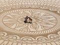 Beautiful sand mandala with its artist named Vitor Raposo