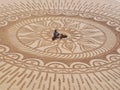 Beautiful sand mandala with its artist named Vitor Raposo