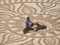 Beautiful sand mandala with its artist named Vitor Raposo