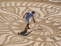 Beautiful sand mandala with its artist named Vitor Raposo