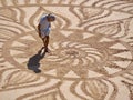 Beautiful sand mandala with its artist named Vitor Raposo