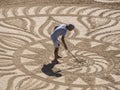 Beautiful sand mandala with its artist named Vitor Raposo