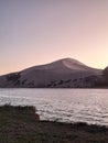 Beautiful sanddune at sunset with water