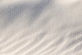 Beautiful sands background. Shadows and patterns on the sand of dune. Background, sand, light, beige, wave, reflect, shadow, Royalty Free Stock Photo