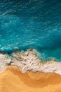 Beautiful sandy beach with blue sea, vertical view. Drone view of tropical blue ocean beach Nusa penida Bali Indonesia.