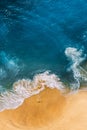 Beautiful sandy beach with blue, vertical view. Drone view of tropical blue ocean beach Nusa penida Bali Indonesia. Royalty Free Stock Photo