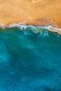 Beautiful sandy beach with blue water, vertical photo. Wild beach with beautiful clear sea. Yellow sand with blue sea. Clean beach Royalty Free Stock Photo