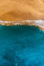 Beautiful sandy beach with blue water, vertical photo. Wild beach with beautiful clear sea. Yellow sand with blue sea. Clean beach Royalty Free Stock Photo