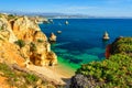 Beautiful sandy beach Praia do Camilo with wooden walkway near Lagos. Algarve region, Portugal Royalty Free Stock Photo