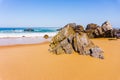Beautiful sandy beach with rocks on Atlantic coast, Portugal Royalty Free Stock Photo