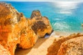 Beautiful sandy beach among rocks and cliffs near Lagos, Algarve region, Portugal Royalty Free Stock Photo