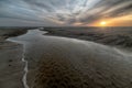 Beautiful sandy beach with a sea during the low tide Royalty Free Stock Photo