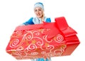 beautiful Santa helper holding sparkly Christmas present Royalty Free Stock Photo