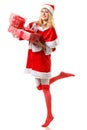 beautiful Santa helper holding sparkly Christmas present Royalty Free Stock Photo