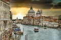 Beautiful Santa Maria della Salute in Venice at sunset with view on the canal with boats