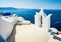 Beautiful Santorini skyline view. Blue sea, sky and white church with blue roof