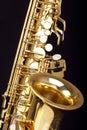 Beautiful saxophone on black background, closeup. Musical instrument