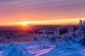 Beautiful scarlet sunset in winter mountains