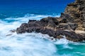 Beautiful scene of the blue ocean waves crashing on the cliffs in Halona Cove, Oahu, Hawaii Royalty Free Stock Photo