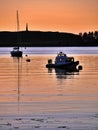 Beautiful scene of boats with reflection at sunset, Oban, Scotland Royalty Free Stock Photo