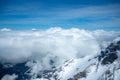 Beautiful scene of clouds and mountains looking from viewpoint at Jungfrau with blue sky Royalty Free Stock Photo