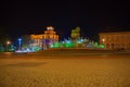 Beautiful scene of Kutaisi in a New Year night. City night plaza in autumn with paths strewn Royalty Free Stock Photo