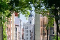 Beautiful scene of the Metropolis Building from a natural frame of trees under sunlight Royalty Free Stock Photo