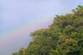 Beautiful scene of rainbows over green mountain with blue sky in Autumn.