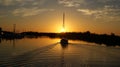 Sailboat heading out to the sunset