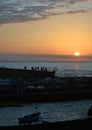 Beautiful scene with traditional fisherman boat and people silho