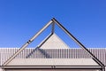 Beautiful scene of Triangular roof frame against Clear blue sky background in town Royalty Free Stock Photo