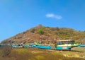 Beautiful scenery with boats and a hill Royalty Free Stock Photo