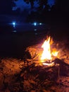 Beautiful scenery campfire at the beach after sunset