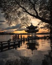 Beautiful scenery in the city of Hangzhou with a famous traditional building at sunset