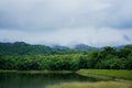 Beautiful scenery of cloud and foggy overcast greenery rain forest mountain with lake landscape at Jedkod- Royalty Free Stock Photo