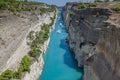 Beautiful scenery of the Corinth Canal in a bright sunny day against a blue sky with white clouds. Royalty Free Stock Photo