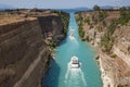 Beautiful scenery of the Corinth Canal in a bright sunny day against a blue sky with white clouds. Royalty Free Stock Photo