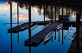 Beautiful scenery of a dock on the side of a river with mirror reflection of the sky on water Royalty Free Stock Photo