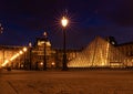 Beautiful scenery of the famous illuminated Louvre in Paris, France at night time Royalty Free Stock Photo