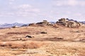 Beautiful scenery. Gray stones. Mountain landscape. Dry grass