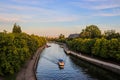 Blue river and a boat in Kaliningrad, Russia. Beautiful city view in European travel destination.