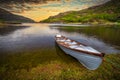 Beautiful scenery of the Killarney lake with boat at sunset in county Kerry, Ireland Royalty Free Stock Photo