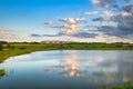 Beautiful scenery of the lake with amazing clouds before sunset, Poland Royalty Free Stock Photo