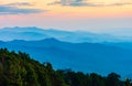 Beautiful scenery landscape of rainforest on mountain ridge with mist at sunset in the evening Royalty Free Stock Photo